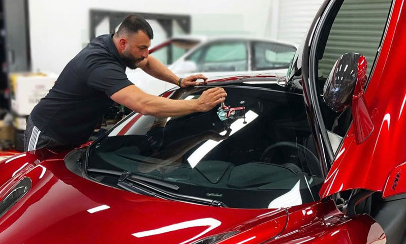 SD Auto Glass Employee working on windshield